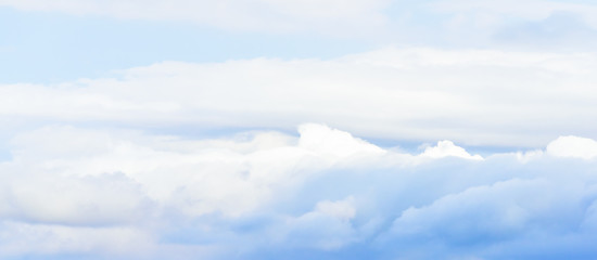 Beautiful puffy clouds isolated against blue skies