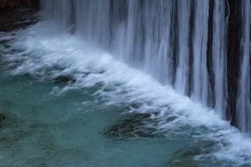 interesting unusual visible on a mountain waterfall on a sunny day for background or screensaver,