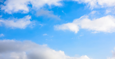 Beautiful puffy clouds isolated against blue skies