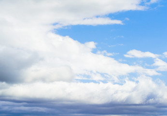 Beautiful puffy clouds isolated against blue skies