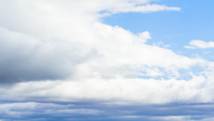 Beautiful puffy clouds isolated against blue skies