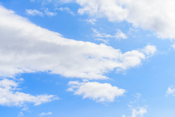 Beautiful puffy clouds isolated against blue skies