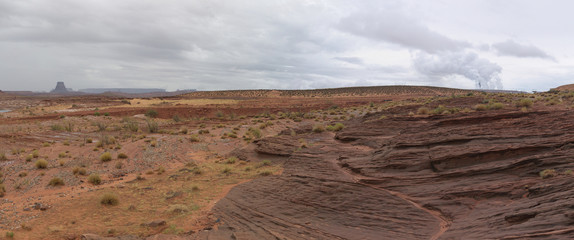Fototapeta premium Arizona desert landscape Panoramic view with distant buttes and layered red rock strata