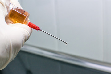 Nurse with vaccine in syringe