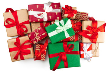 Top view of pile of christmas gifts on white background