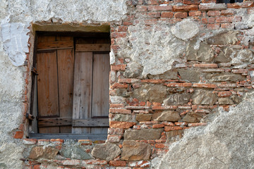 wooden hatch in the wall of an abbey in the city of Prostejov, CZ