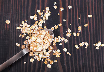 Oatmeal on a wooden table close-up.