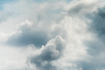 Beautiful puffy clouds isolated against blue skies