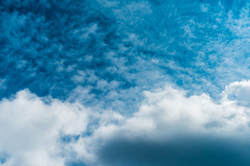 Beautiful puffy clouds isolated against blue skies
