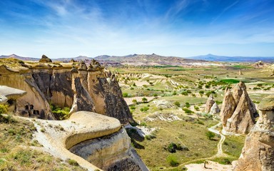Amazing rocks in Cappadocia near Goreme eroded into spectacular pillars and minaret-like forms. - obrazy, fototapety, plakaty