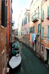 Fototapeta na wymiar Venice, Italy, December 28, 2018 evocative image of Venice canal with moored boats