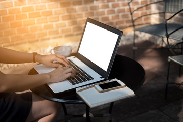 Woman using laptop to working on desk, mock up on screen, freelance and business woman