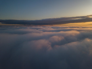 View above clouds during sunrise. Dramatic view the sky.