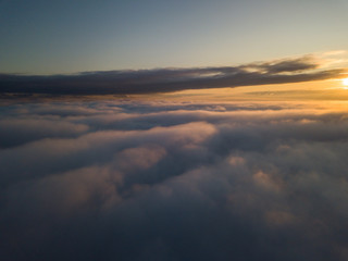View above clouds during sunrise. Dramatic view the sky.