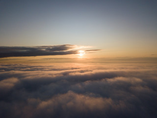 View above clouds during sunrise. Dramatic view the sky.