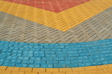 yellow, red and blue paving tiles for background or texture