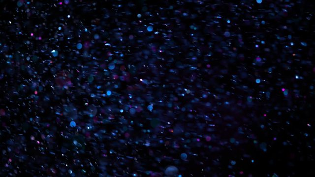 Colored Glitter Background in Super Slow Motion at 1000fps. Shooted with High Speed Cinema Camera in 4K Resolution.