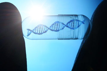 DNA double helix in a capsule as a symbol of genetics, genetic research and genetic manipulation