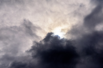 Fototapeta na wymiar Beautiful puffy clouds with sun beams against blue skies. 