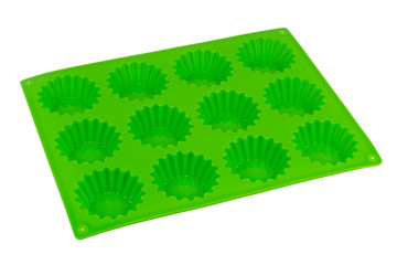 Silicone form for baking a few cupcakes.