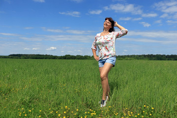 Woman portrait among the grass