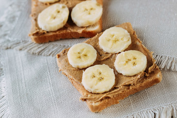 sandwich with peanut butter and bananas. Healthy and tasty breakfast or snack.