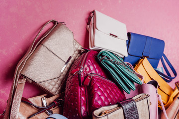 Fashionable handbag and backpack. Against the background of a heap of bags. Set to choose from. .