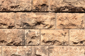 Vintage grunge sandstone blocks wall texture.