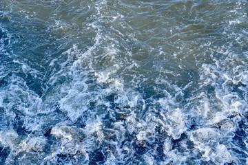 Fototapeta na wymiar stormy flowing water, background image