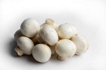 fresh champignon mushrooms on a white background