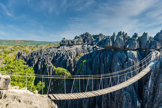 Bridge over a gap at the Tsingy de Bemaraha National Park, Madagascar - Powered by Adobe