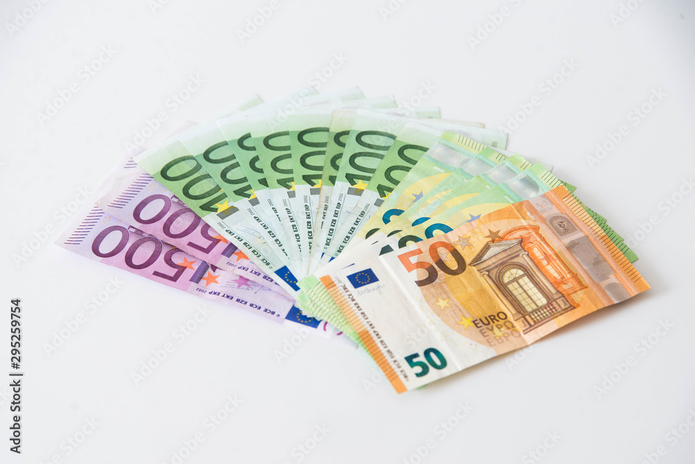 Wall mural stack of euro money on white background