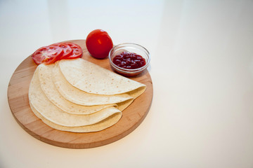 Delicious tortillas on kitchen table