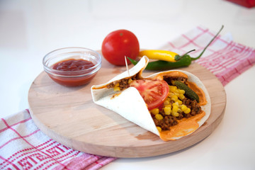 Delicious tortillas on kitchen table