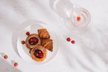 Raspberry filled pastries with sugar sprinkles. Selective focus.