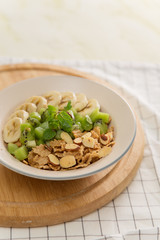 Healthy breakfast: corn flakes with milk and fresh fruits