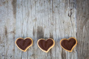 Chocolate heart on wooden background for gift in Valentine's day love. Select focus and Copy space background