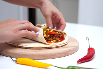 Delicious tortillas on kitchen table