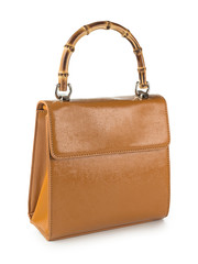 Leather handbag with wooden handles isolated on white background