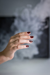 manicure disinfection with spray on a gray background