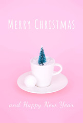 Creative Christmas design on pink pastel color background with Christmas tree.