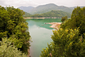 Fototapeta premium Landscape on Lake Salto in Central Italy. Artificial Lake of Italy. Panoramic view of the Lake. Lake with creeks. Wild and unspoiled nature.