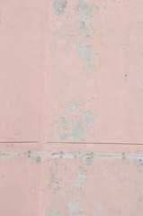 古いピンク色の壁