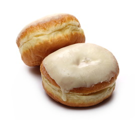 Doughnuts with vanilla cream icing isolated on white background