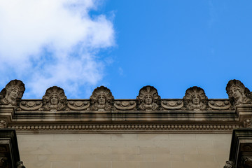 United States of America - New York - museum rooftop - statues looking down contrasting with the blue sky