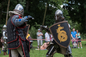 Naklejka premium Reconstruction of the battle of medieval knights