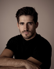 Fototapeta premium Young attractive latin man posing looking sensual and handsome. Beauty concept and lifestyle