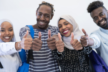 african students group showing ok thumbs up