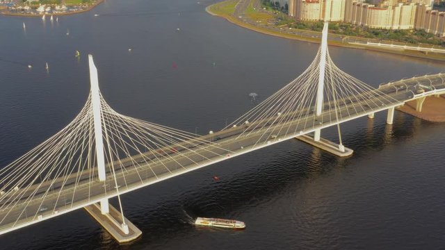 Aerial around view of cable-stayed bridge with cars in St.Petersburg, 4k