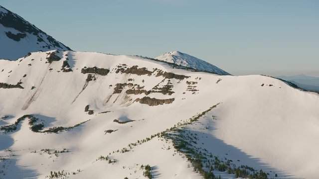 Cascade Mountains, Oregon circa-2019.  Aerial view of Sisters Mountains.  Shot from helicopter with Cineflex gimbal and RED 8K camera.